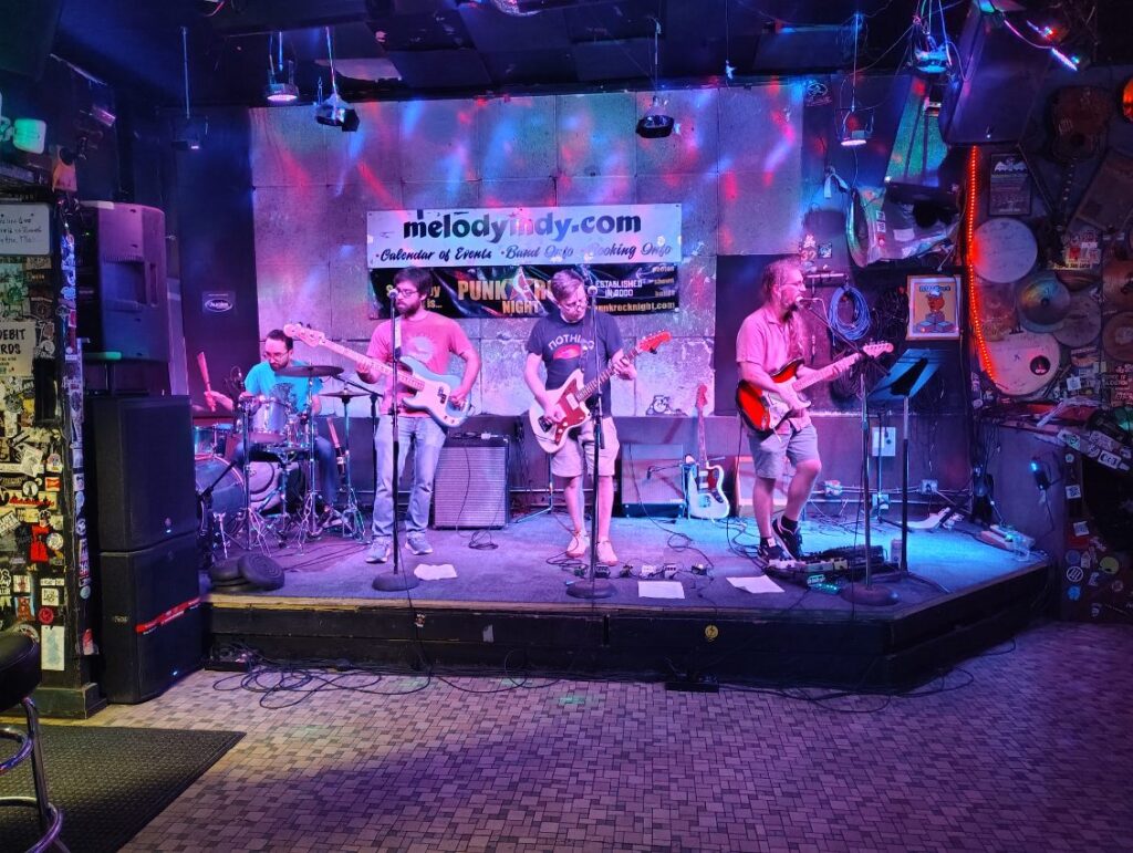 Four musicians play onstage at The Melody Inn.